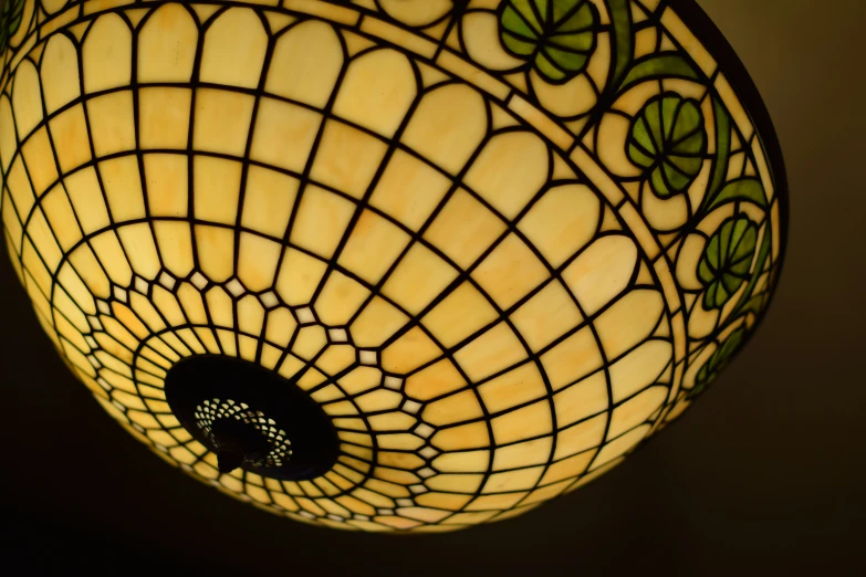 a decorative lamp shade that is hanging from the ceiling