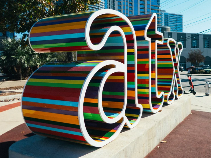 some letters written out in front of some buildings