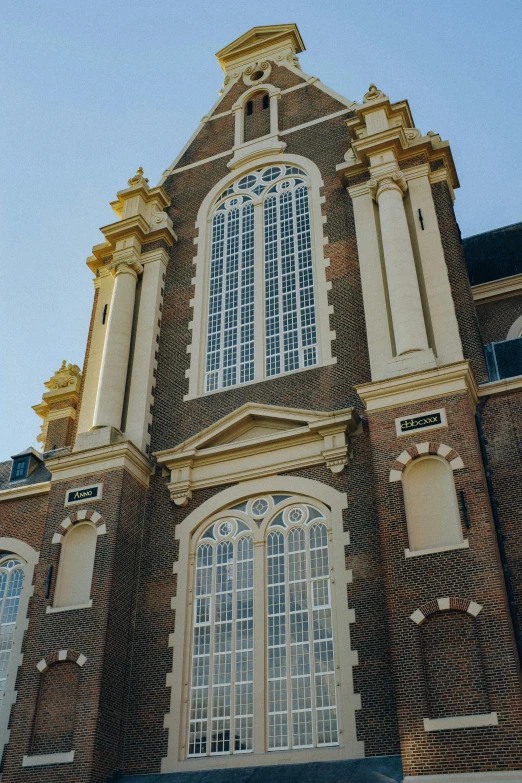 the top half of a building with a sky background