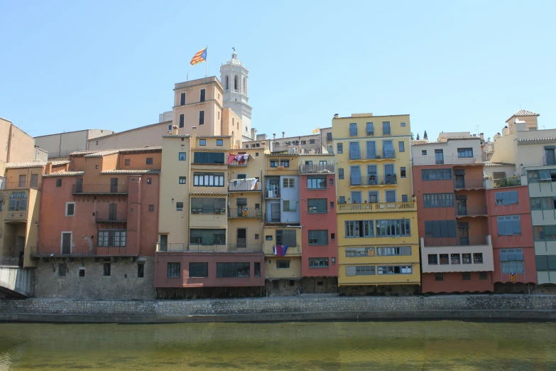 some buildings on the side of a river