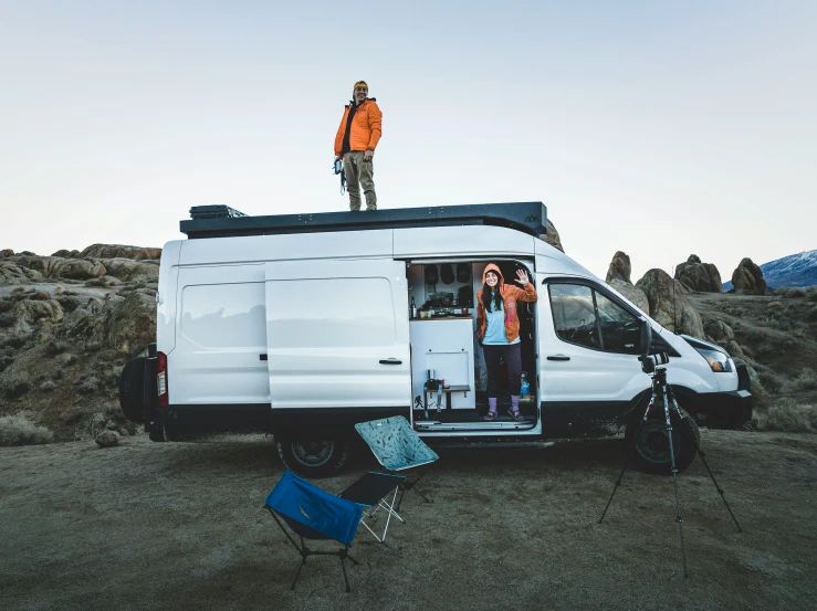 a couple of people in the back of a van