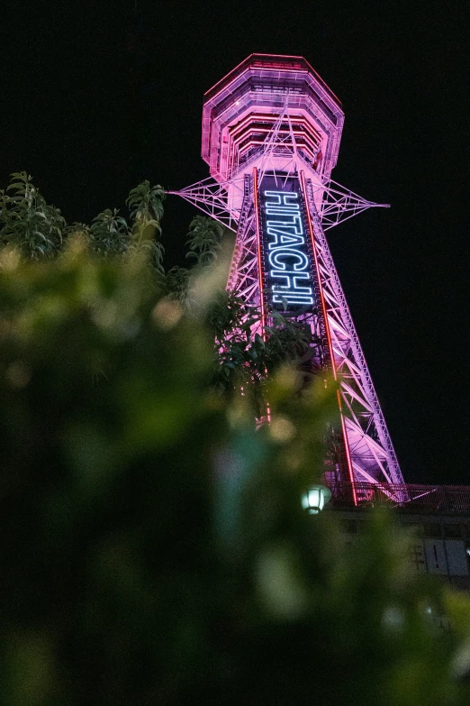 a very large tower lit up with lights on it