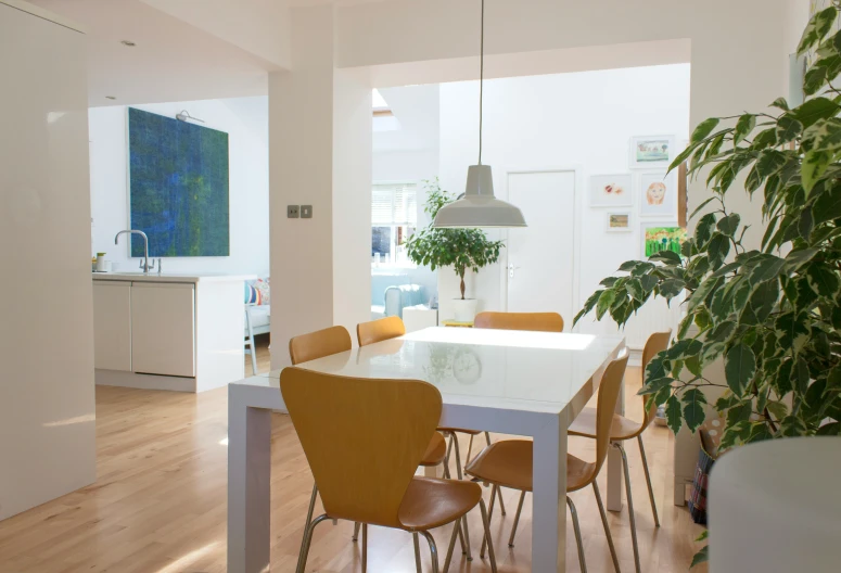 a dining room with a table set for six