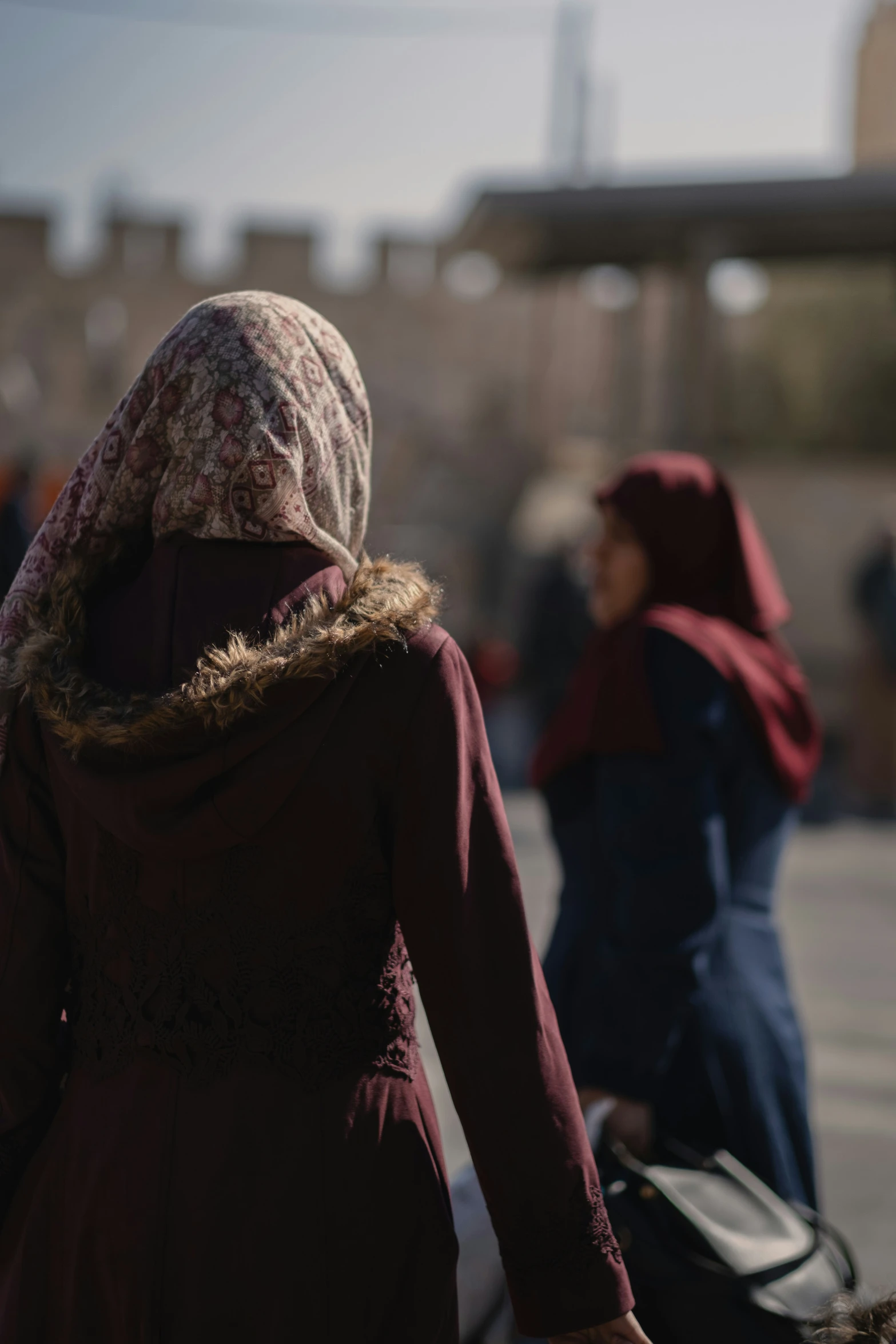 a person in a red dress walks away