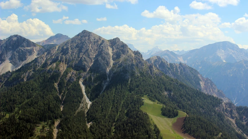 a scenic view of the mountains and surrounding forest