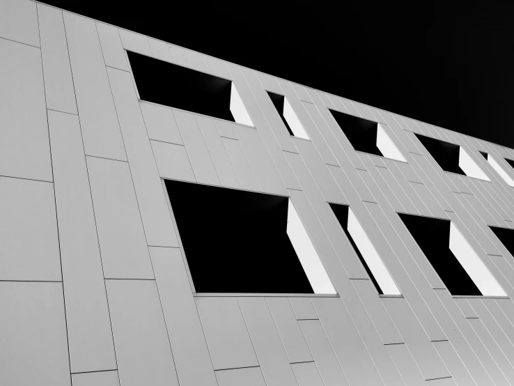 the silhouette of a building on a very dark day