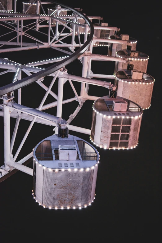 a big ferris wheel with lights at night