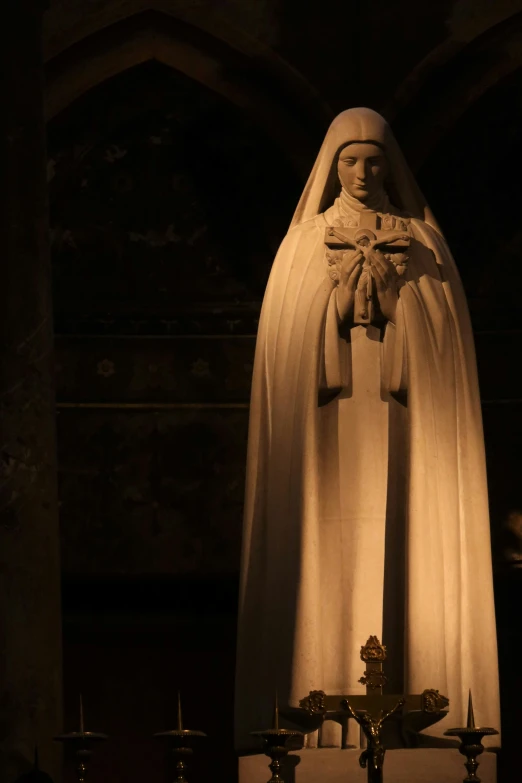 a statue of a woman in the middle of a church