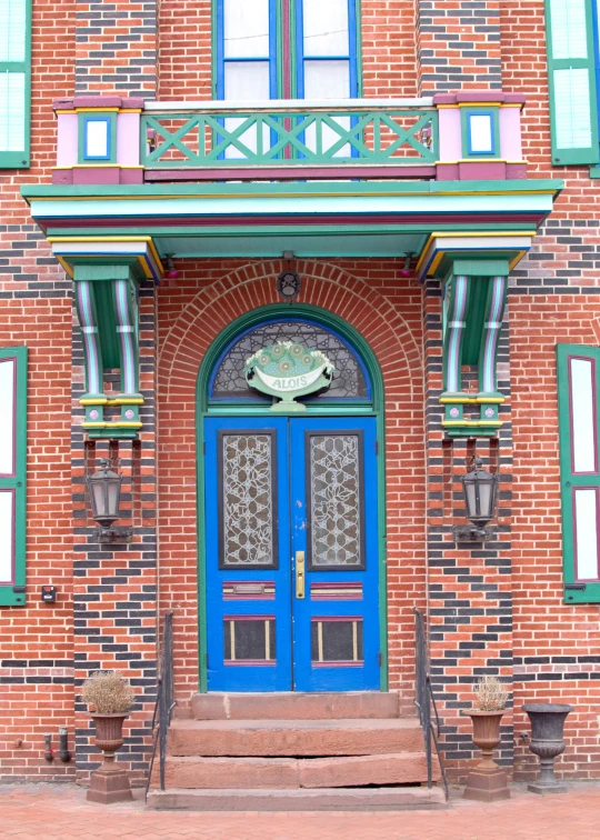 an entrance to a building with ornate doors and windows