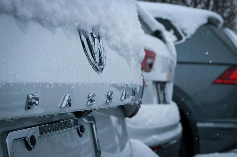 closeup of the cars covered with snow