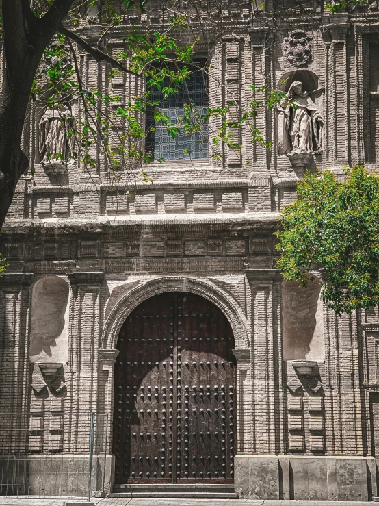 an old stone building with stone arches and doors