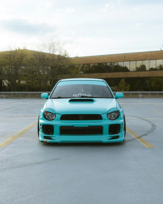 a subarun car sits in the parking lot