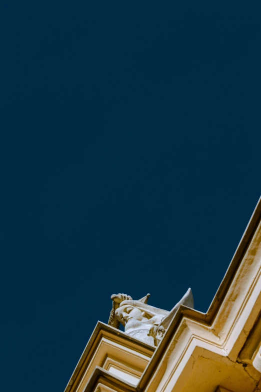 a large clock tower towering above a blue sky