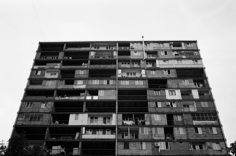 a tall building that has lots of balconies