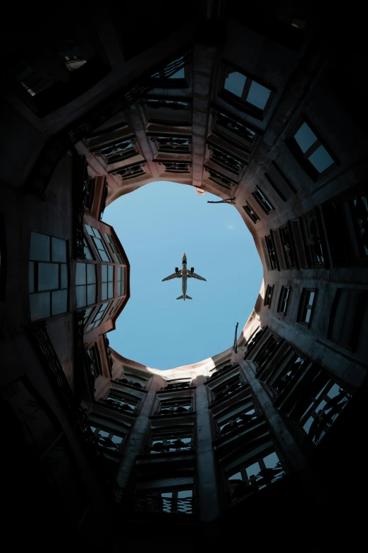 an airplane flies through the air in a round area