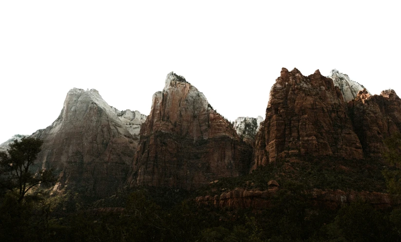 a couple of mountain's standing in the distance