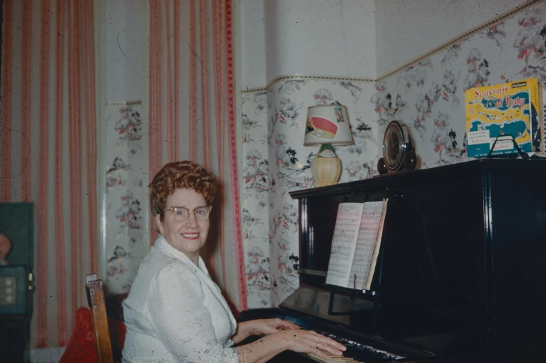 an older po of a woman playing piano