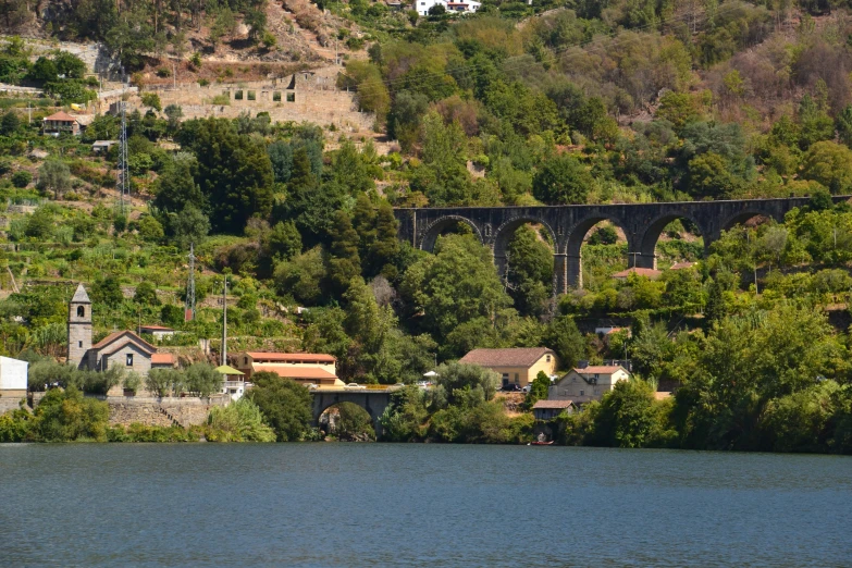 a bridge that has a view on it and the water