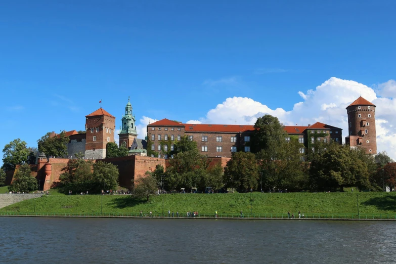 a building is shown next to a lake