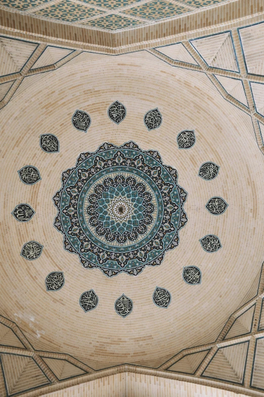 a large, intricate ceiling with decorative ornaments in the center