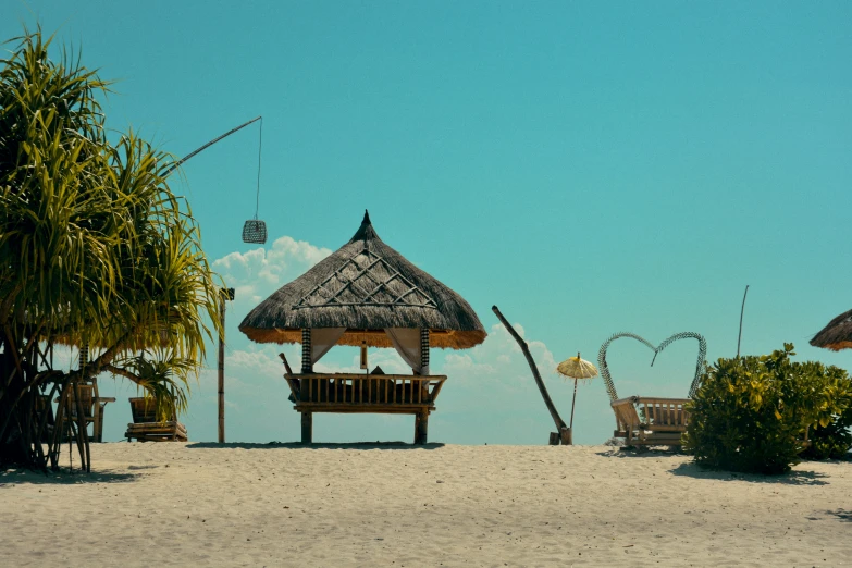 a hut that is sitting on top of a beach