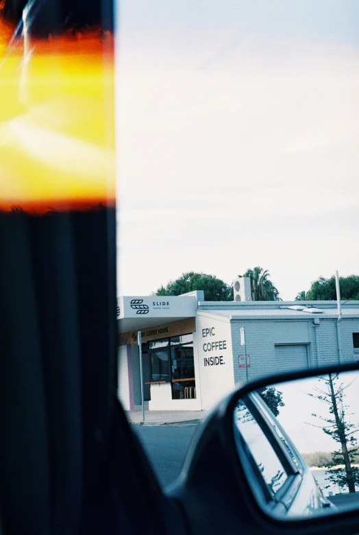 the side view mirror is seen looking into the side window