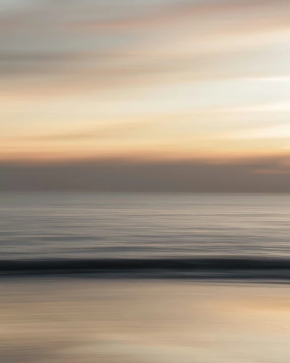 a picture of the ocean at sunset time