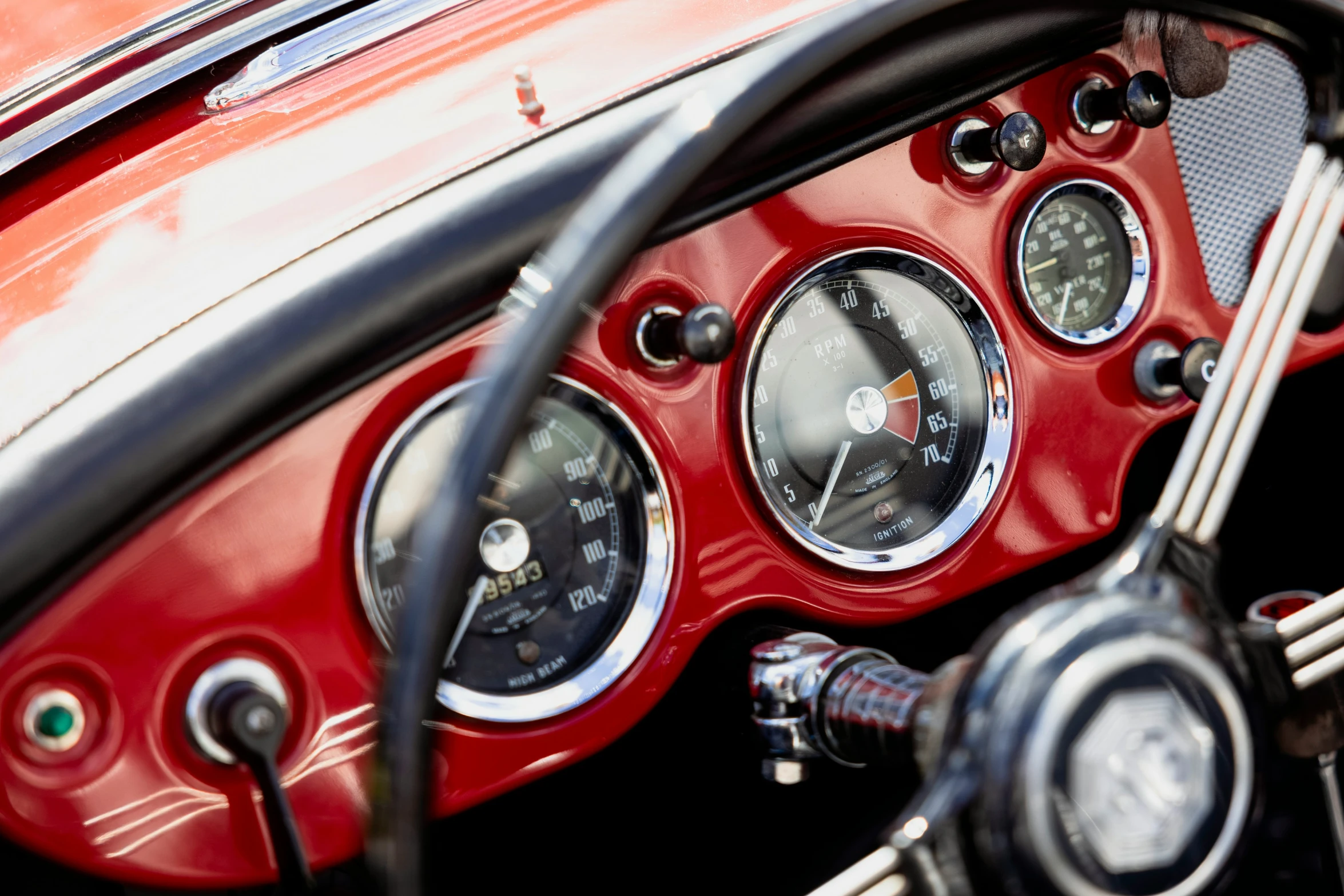 the dashboard and gauges of a car on a road