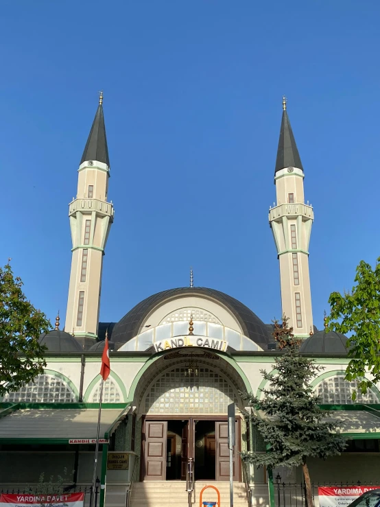 an ornate building with two spires and a clock tower