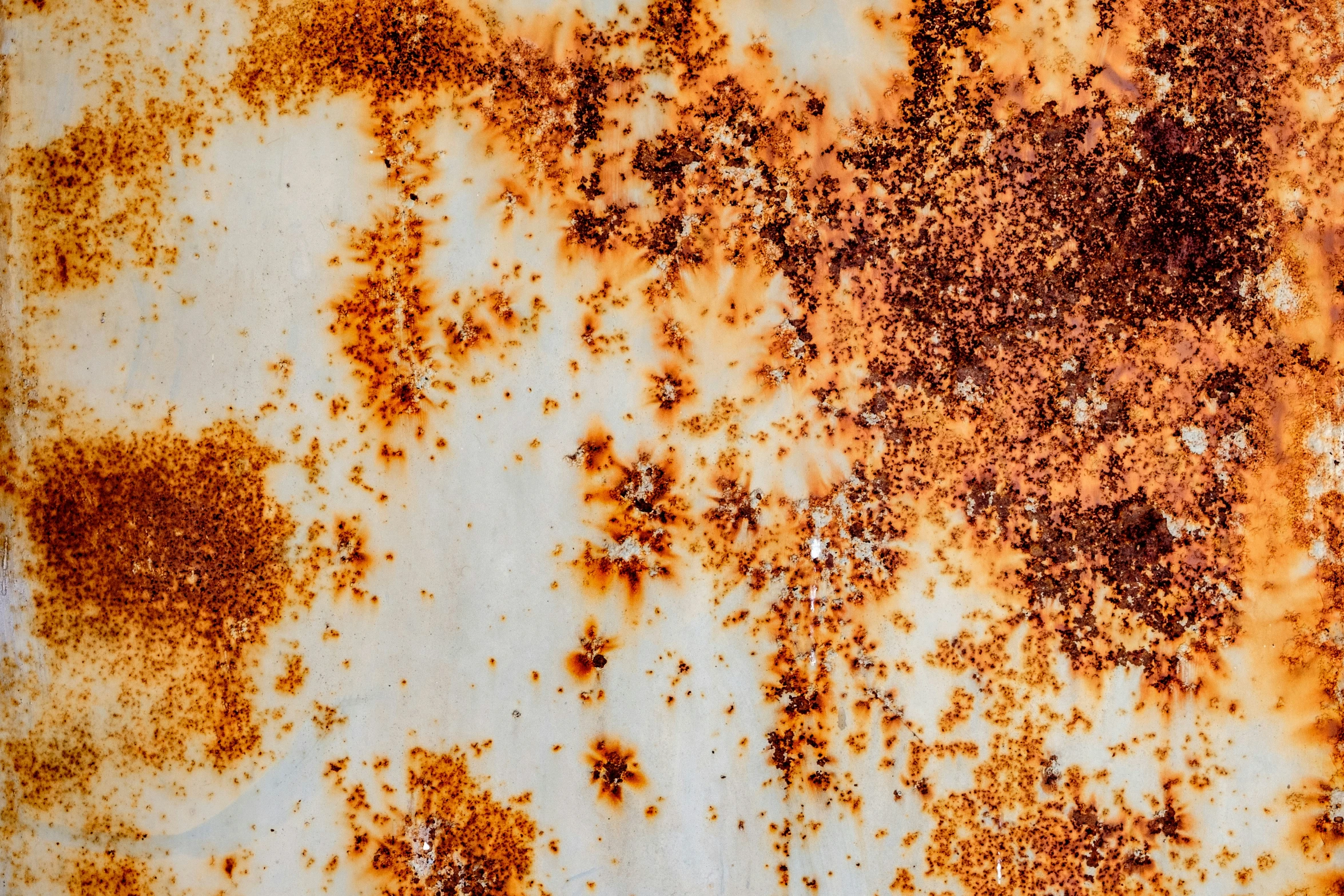 rust and white paint is seen on the wall
