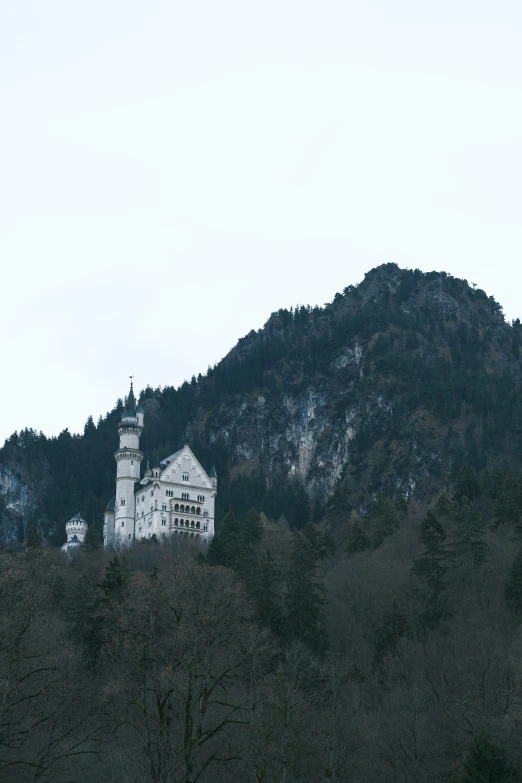 a large white house on top of a mountain