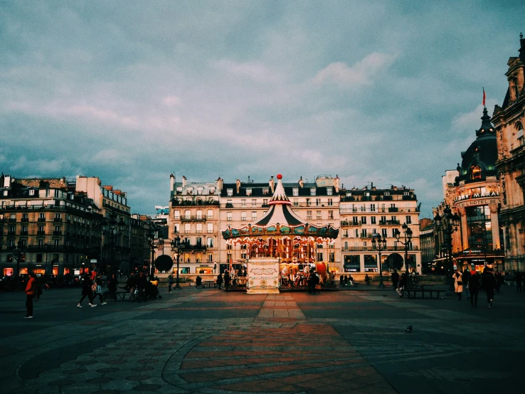 an older carousel in the center of a large city