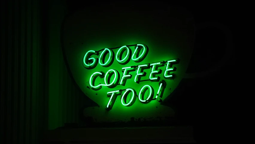 a neon green sign that reads go coffee too