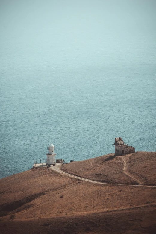 two towers that are on top of a hill