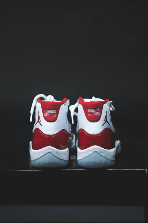 this sneaker is red and white with a splash of red on the upper part