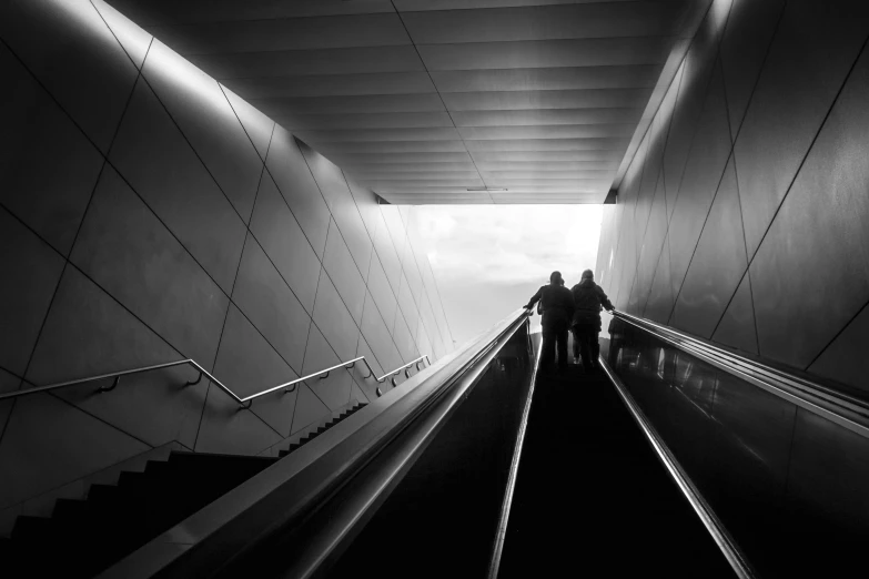 the two people are going up the stairs together