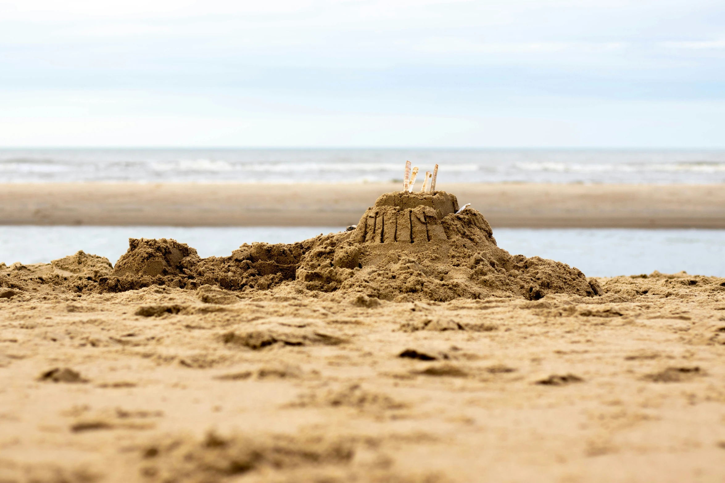 sand sculpture with the words love spelled out in the middle