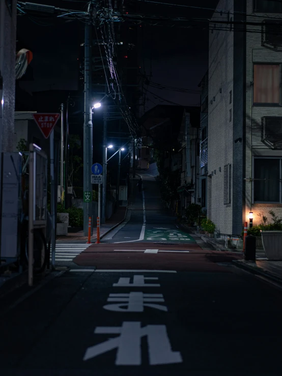 the street lights in front of a very tall building