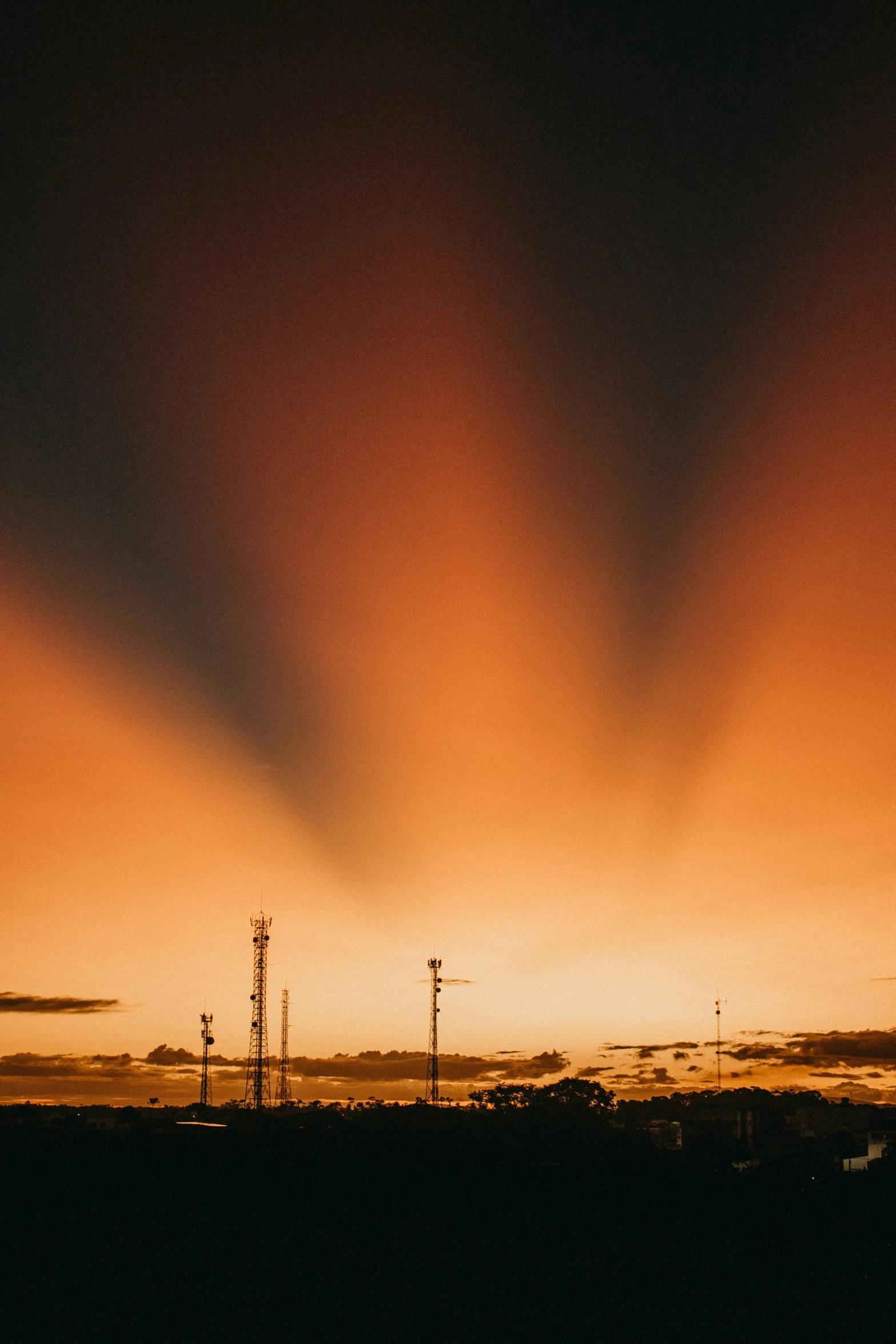 dark sky with yellow and orange colors and light reflecting off water