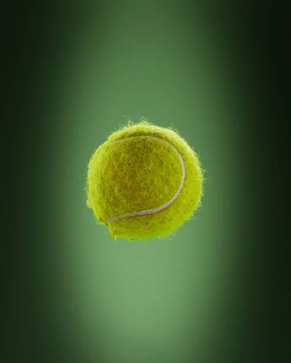 an up close s of the tennis ball that is flying through the air
