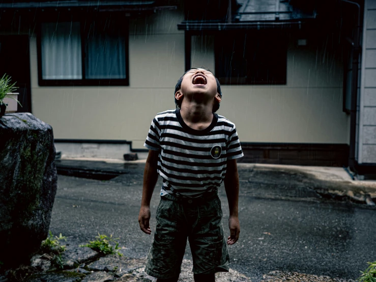 a man is standing in front of a house and has his eyes wide open