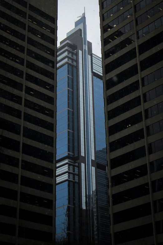 a view of buildings with reflection on water in it