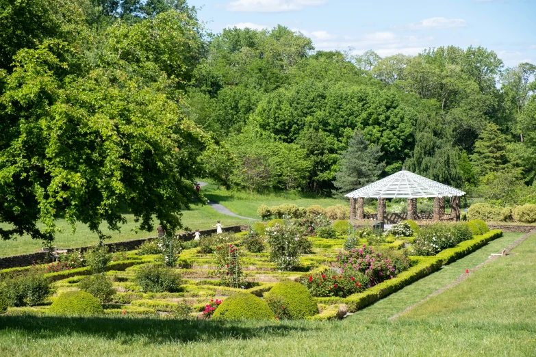 the garden is beautiful and peaceful in the shade of some trees