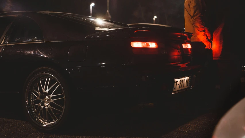 a close up of a car parked on the side of a road