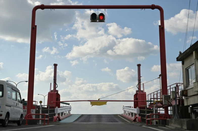 a traffic light on an elevated street crossing over a bridge