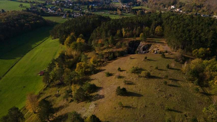 a country setting with a small village on the hill