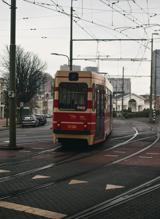 a trolley that is traveling down the road