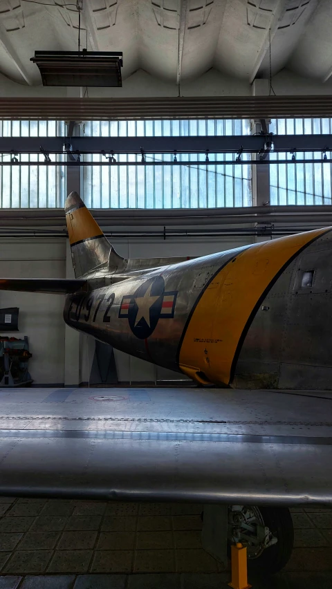 an old airplane in a hanger in a building