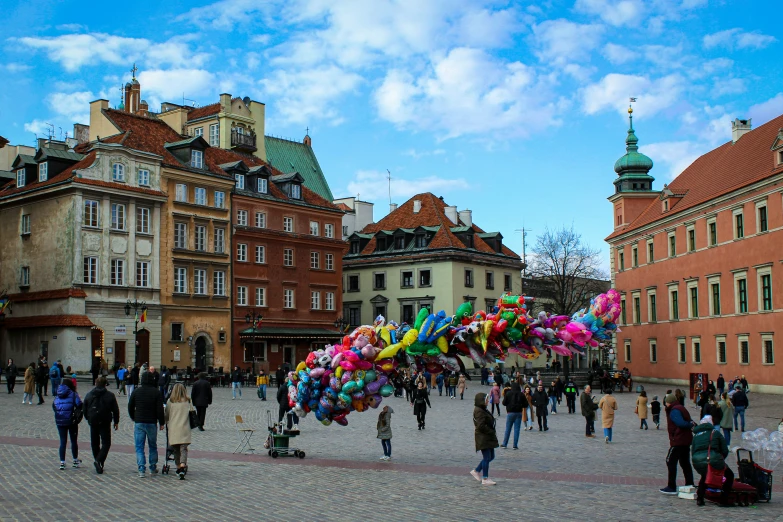 a group of people on a city square