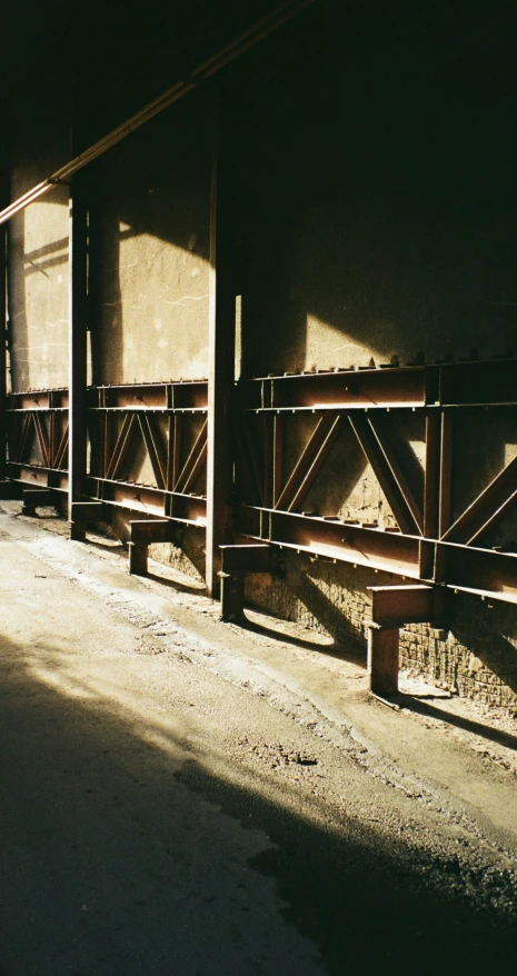 there is a old wooden fence between some buildings